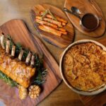 Roast rack of pork with oven baked potatoes recipe