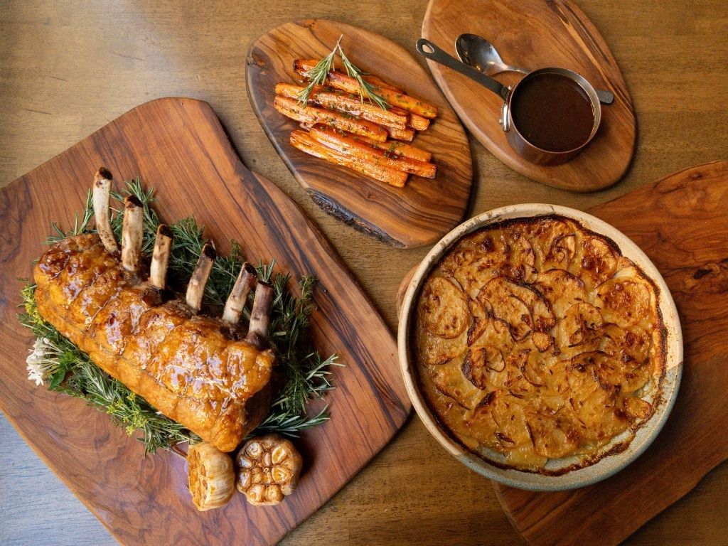 Roast rack of pork with oven baked potatoes recipe